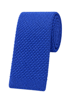 A vibrant royal blue textured knit necktie, partially unrolled to display its fine woven pattern, set against a clean white background.